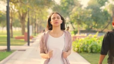Indian girl tired after running in a park in morning time