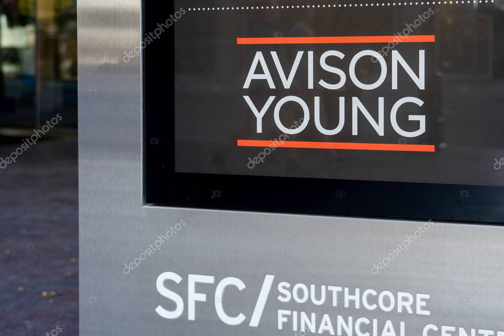 Toronto, Canada - October 28, 2020: Avison Young company sign is seen outside their headquarter office building in downtown Toronto. Avison Young is a commercial real estate services firm.