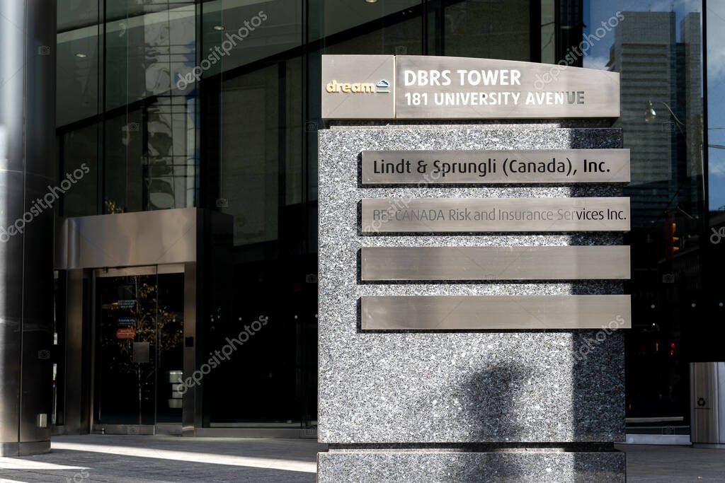 Toronto, Canada - November 14, 2020: Lindt and Sprungli Canada, BFL canada, company sign on the ground directory sign outside DBRS Tower on University Ave. in Toronto.
