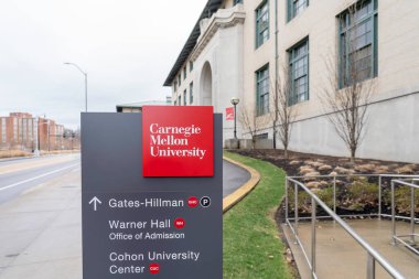 Pittsburgh, Pennsylvania, USA - January 11, 2020: Building and sign for Carnegie Mellon University in Pittsburgh, Pennsylvania, USA. Carnegie Mellon University is a private research university.  clipart