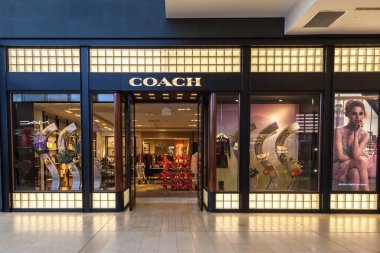 Toronto, Canada - February 23, 2018: Coach storefront in the shopping mall in Toronto. Coach is a leading design house of modern luxury accessories and lifestyle collections. clipart