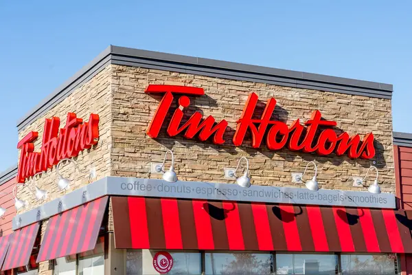 stock image TORONTO, CANADA - February 24, 2018: Sign of Tim Hortons, a Canadian-based multinational fast food restaurant known for its coffee and donuts. 