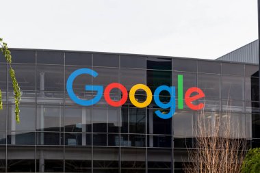 Close up of the Google logo sign on the building in Mountain View, California, USA - June 12, 2023. Google LLC is an American multinational technology company.  clipart