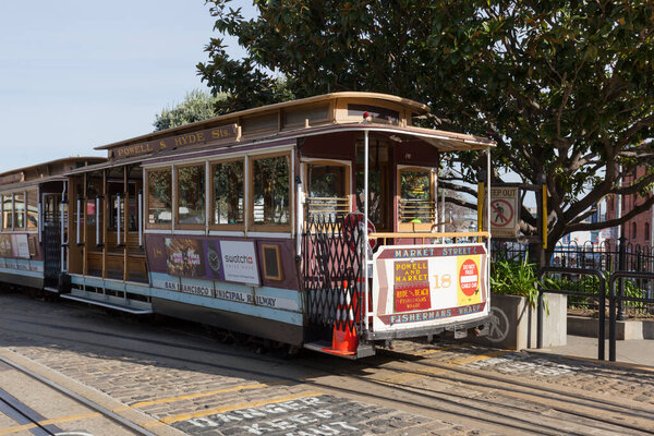 San Francisco, California, USA - April 2, 2018: Cable car at Fisherman's Wharf The San Francisco cable car system is the world's last manually operated cable car system.  