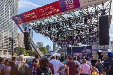 TORONTO, ONTARIO, CANADA - JUNE 29, 2017: Staffs preparing the stage on Nathan Phillips square for The 150th anniversary of Canada celebration, Toronto, Canada clipart