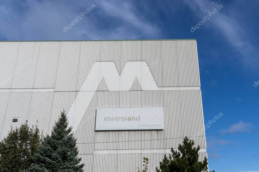 A close up Metroland company sign on the building in North York, Toronto, ON, Canada, on October 22, 2023. Metroland Media Group is a Canadian mass media publisher and distributor.
