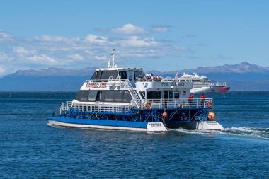 A Rumbo Sur Cruise ship on the sea near Ushuaia Cruise Port, Tierra del Fuego province, Argentina - January 28, 2023. Rumbo Sur is a travel agency that offers various excursions. clipart