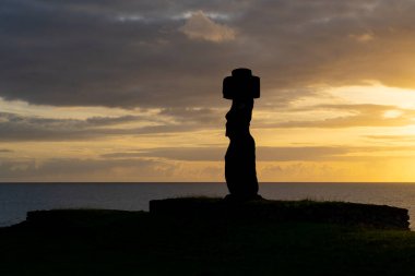 Easter Island, Chile - March 3, 2023: Sunset behind the moai of Ahu Ko Te Riku in Tahai complex on Easter Island (Rapa Nui) in Chile. Tahai is an archaeological complex near the village Hanga Roa. clipart