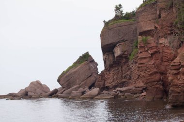 Indian Head Rock (The Indian Who Never Sees the Sea), St.-Georges-de-Malbaie, Gaspe Peninsula, Quebec, Canada. clipart