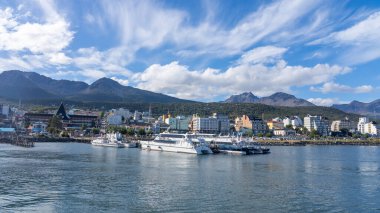 City view of Ushuaia from the sea in Tierra del Fuego province, Argentina - January 28, 2023. Ushuaia is a resort town in Argentina, nicknamed the End of the World. clipart
