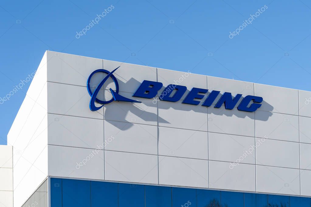 Irving, Texas, USA - March 20, 2022: Closeup of Boeing sign on the building in Irving, Texas, USA. The Boeing Company is an American multinational corporation.