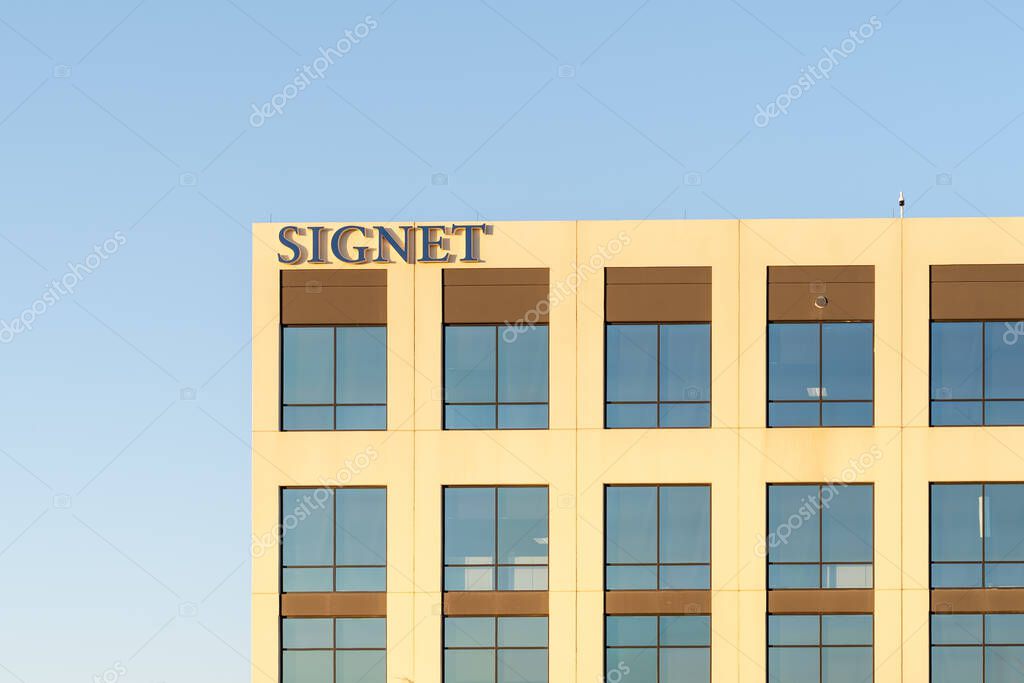 Coppell, TX, USA - March 19, 2022: Signet Jewelers company sign on the building at its headquarters in Coppell, Texas, USA. Signet Jewelers operates in the Jewelry, Precious Stones and Metals business
