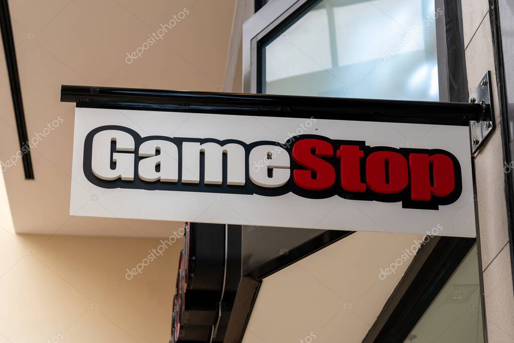 Houston, Texas, USA - March 6, 2022: GameStop store projecting sign at a shopping mall in Houston, Texas, USA, an American video game, consumer electronics, and gaming merchandise retailer.