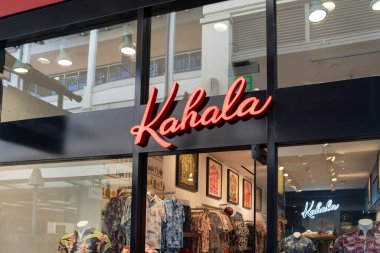 Honolulu, HI, USA - January 14, 2024: Close-up of the Kahala logo sign at their store in a shopping mall in Waikiki, Hawaii. Kahala is Hawaii's oldest operating clothing company. clipart