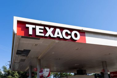 Kauai, HI, USA - January 27, 2024: Close-up of Texaco logo sign at one of their gas stations in Kauai, HI, USA, on January 27, 2024. clipart