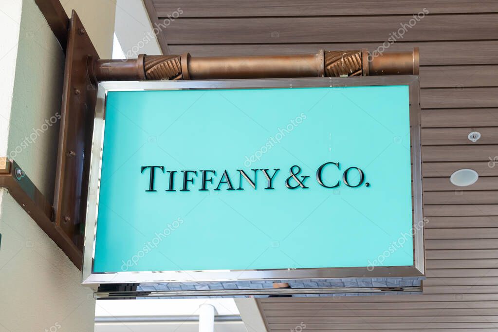 Honolulu, HI, USA - January 14, 2024: Tiffany and Co. hanging sign at their store in a shopping mall in Waikiki, Hawaii. Tiffany and Co. is an American luxury jewelry.