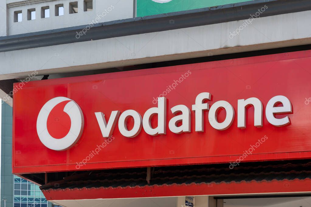Suva, Fiji - February 27, 2024: Close up of a Vodafone logo sign on the building in Suva, Fiji. Vodafone Group Plc is a British multinational telecommunications company