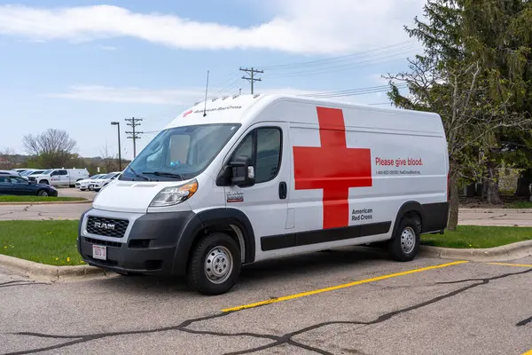 stock image Two American Red Cross vans in the parking lot. Madison, WI, United States, May 4, 2023.