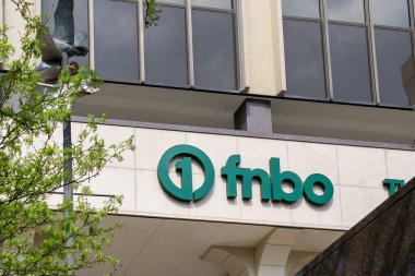 fnbo (First National Bank Omaha) logo sign at their headquarters in Omaha, Nebraska, USA, May 7, 2023. clipart