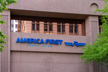 America First Credit Union sign on the building in downtown Salt Lake City, Utah, USA - June 21, 2023. America First Credit Union is an American federally chartered credit union. clipart