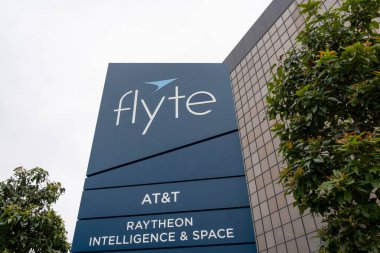 A directory sign with company names Flyte, AT and T and Raytheon Intelligence and space is seen at 2200 Imperial Hwy in El Segundo, CA, USA - May 28, 2023. clipart