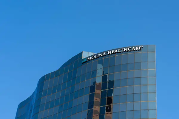 stock image Close up of Molina Healthcare sign on the building at its headquarters in Long Beach, California, USA - May 27, 2023. Molina Healthcare is an American managed care company.