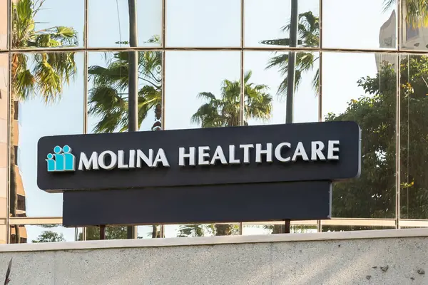 Stock image Close up of Molina Healthcare sign on the building at its headquarters in Long Beach, California, USA - May 27, 2023. Molina Healthcare is an American managed care company.