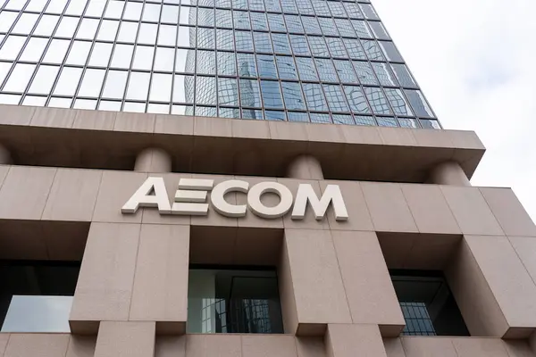 stock image AECOM sign on the office building at 300 S Grand Ave, Los Angeles, CA, United States - May 28, 2023. AECOM is an American multinational infrastructure consulting firm.