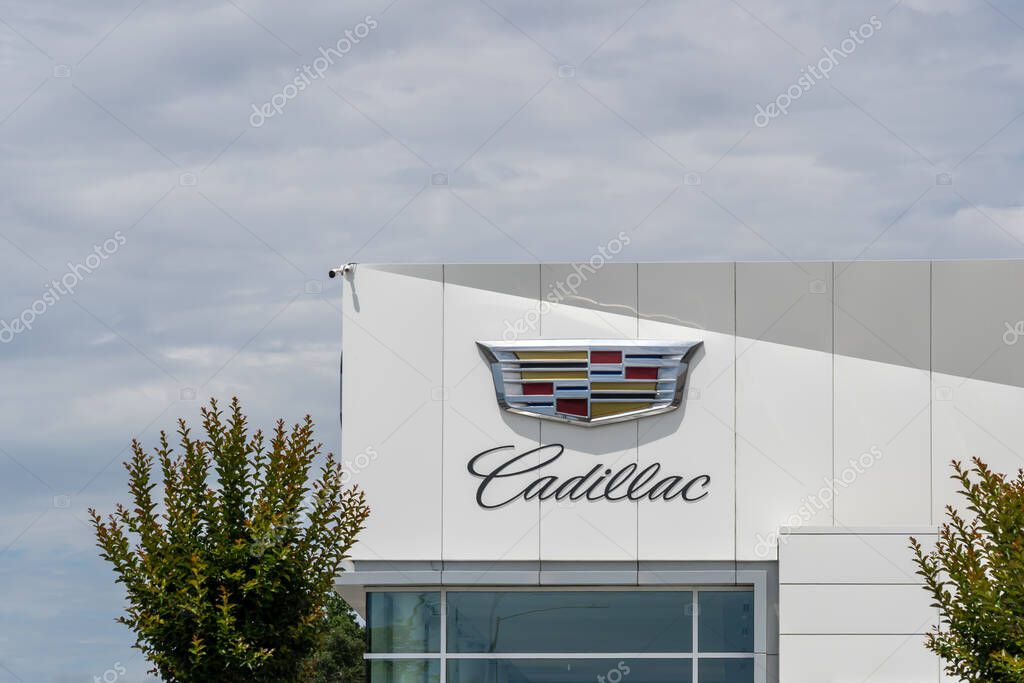 Cadillac logo and sign on the building is seen in Dublin, California, USA - June 12, 2023. The Cadillac Motor Car Division is a division of the American automobile manufacturer General Motors (GM).
