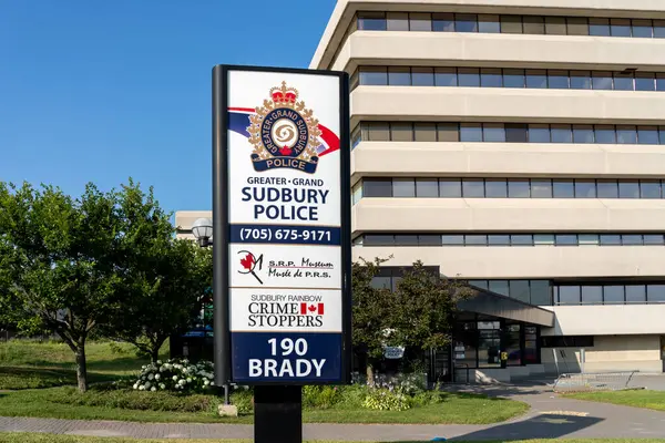 stock image The directory sign for Greater-Grand Sudbury Police Service outside the office building in Greater Sudbury, Ontario, Canada, July 23, 2023.