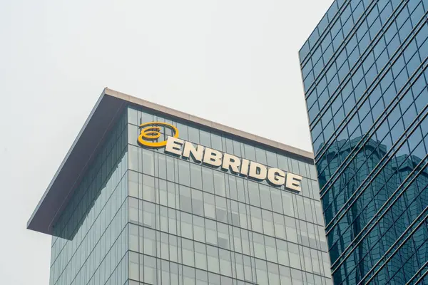 stock image Enbridge logo and sign on the Enbridge Centre building in Edmonton, Alberta, Canada - July 14, 2023. Enbridge Inc. is a multinational pipeline and energy company. 