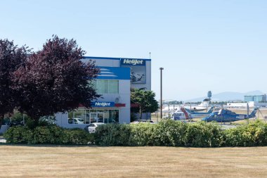 WestJet World Headquarters in Calgary, Alberta, Canada - July 3, 2023: Building of WestJet Airlines Ltd. Canadian airline clipart