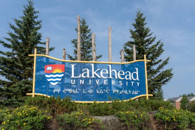 Lakehead University sign is seen at the campus in Thunder Bay, Ontario, Canada - July 22, 2023. Lakehead University is a Canadian public research university clipart