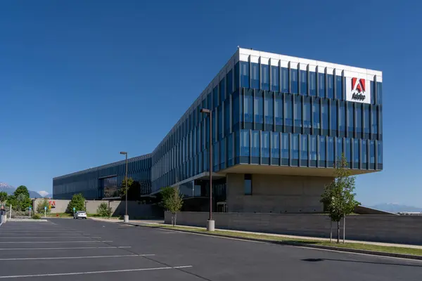 Stock image Adobe logo on the building at its new campus in Lehi City, UT, USA, June 25, 2023. Adobe Inc. is an American multinational computer software company.