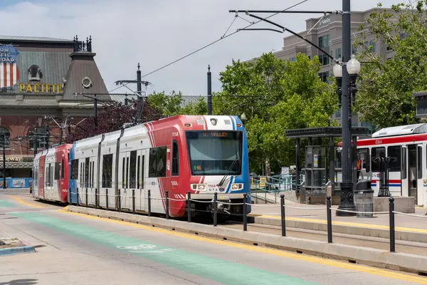 stock image UTA TRAX light rail train at a TRAX station in Salt Lake City, Utah, USA - June 28, 2023. TRAX is a light rail system in the Salt Lake Valley of Utah