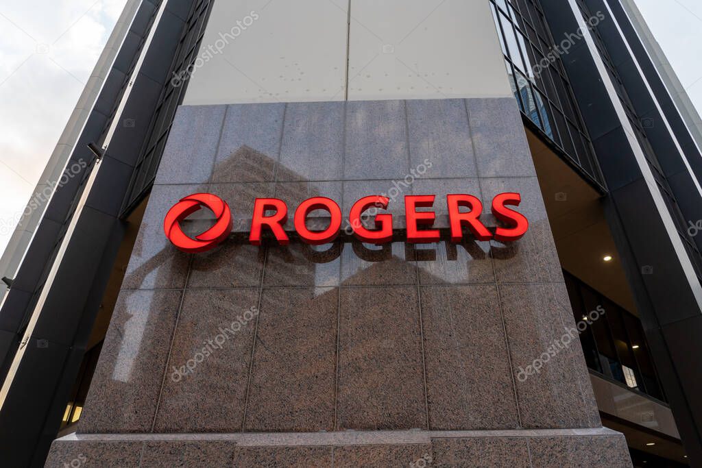 Rogers logo sign on its corporate office building in Altius Centre, Calgary, Alberta, Canada, on July 3, 2023. Rogers Communications Inc. is a Canadian communications and media company.
