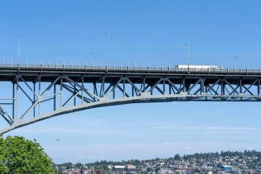 Seattle, WA, USA - June 15, 2023: Part of the Aurora Bridge is seen in Seattle, WA, USA. The Aurora Bridge, officially called the George Washington Memorial Bridge, cantilever and truss bridge. clipart