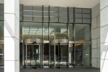 Seattle, WA, USA - June 15, 2023: The entrance to Fourth and Madison building in Seattle, WA, USA. The Fourth and Madison building is a modern, 40-story office building in downtown Seattle.