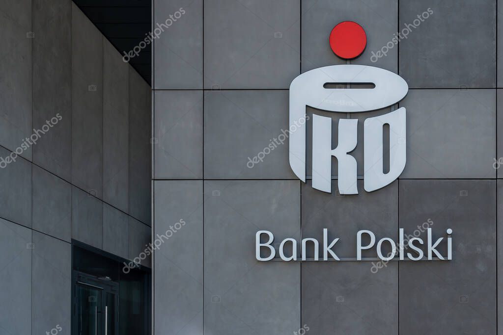 Warsaw, Poland - July 27, 2024: Close up of PKO Bank Polski logo on the office building in Warsaw, Poland. PKO Bank Polski S.A. is a multinational banking and financial services company