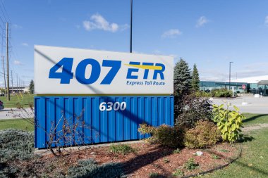 Woodbridge, Ontario, Canada - October 8, 2020: 407 ETR sign at 407 ETR Concession Company Limited Corporate office in Woodbridge, Ontario, Canada. 407 is a tolled highway in Ontario. clipart