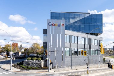 Kitchener, Waterloo, On, Canada - October 17, 2020: Google sign is seen on the office building in Kitchener-Waterloo, Ontario on October 17, 2020. Google is an American technology company.  clipart