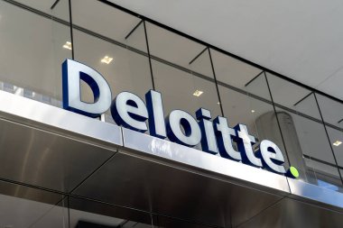 Close up of Deloitte sign on their national head office building in Toronto on October 13, 2020. Deloitte, Deloitte Touche Tohmatsu Limited, is a British professional services network. clipart