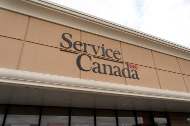 Cambridge, Ontario, Canada - September 27, 2020: A Service Canada sign is seen in Cambridge, Ontario, Canada. Service Canada provides single point of access to government services and benefits. clipart