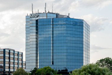 Markham, Ontario, Canada - August 7, 2019: Sign of MNP on the office building in Markham, Ontario, Canada. MNP LLP is one of the largest full-service chartered accountancy and business advisory firms clipart