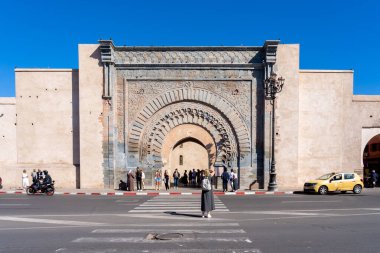 Marrakech, Morocco - November 1, 2024: Tourists in front of Bab Agnaou gate in Marrakesh, Morocco. Bab Agnaou is one of the best-known gates of Marrakesh. clipart