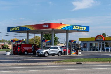 Buffalo, New York, USA - September 22, 2019: One of the Sunoco gas station in Buffalo, New York; Sunoco LP is an American master limited partnership that is a wholesale distributor of motor fuels. clipart