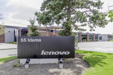 Markham, Ontario, Canada - May 21, 2018: Sign of Lenovo at Lenovo Canada head office near Toronto in Markham. Lenovo is a Chinese technology company with headquarters in Beijing, China. clipart