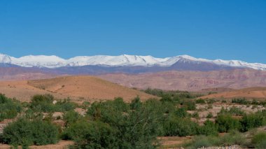 Snow capped Atlas Mountains seen from lower land in 2024 Autumn, Morocco. clipart