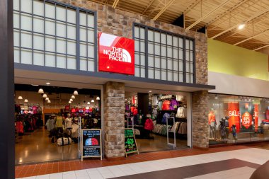 Vaughan, Ontario, Canada - March 17, 2018: North Face storefront in Vaughan Mills Mall in Toronto. North Face is an American outdoor product company specializing in outerwear, footwear and equipment. clipart