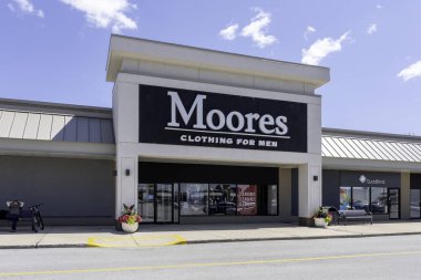 Oakville, Ontario, Canada - July 14, 2019: Moores storefront in Oakville, Ontario, Canada near Toronto. Moores is a Canadian company specializing in business clothing and formalwear for men. clipart